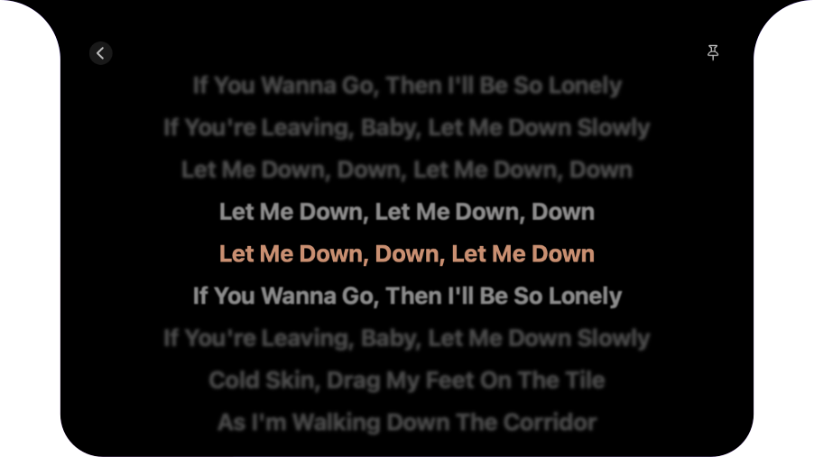 Dynamic Island's actual lyrics view with its original warm highlight and focus blur